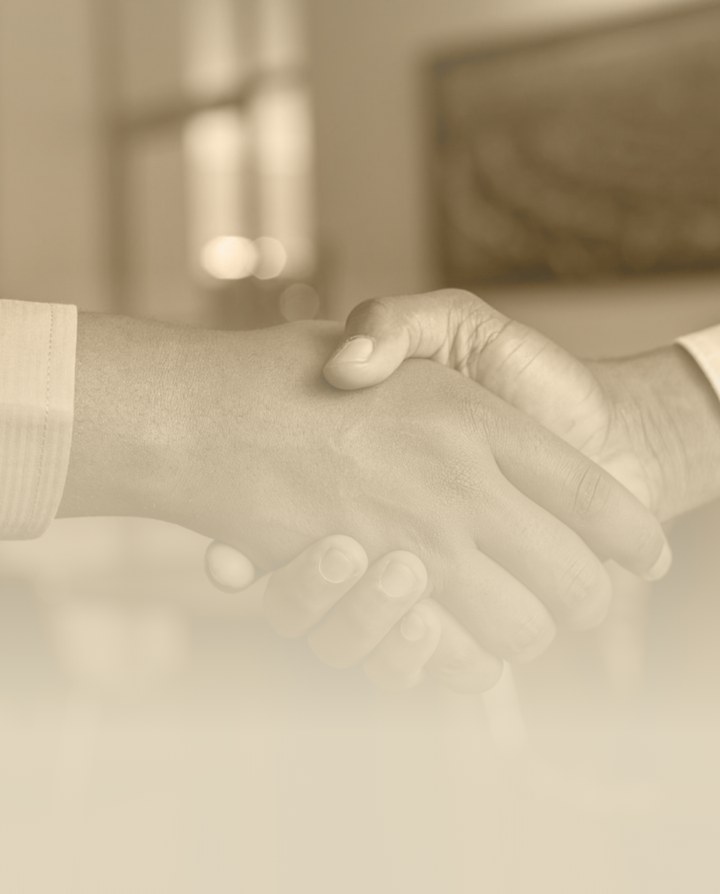 Sepia photo of a handshake representing the 14-day money-back guarantee on a MentionShare audit